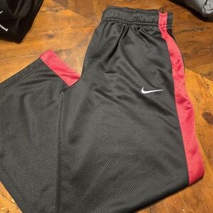 Nike Black Joggers with Red Side Panels and White Swoosh